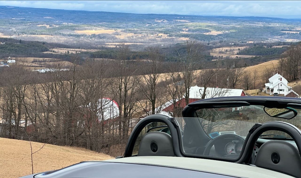 Rolling farmland and valley view from the seat of a convertible